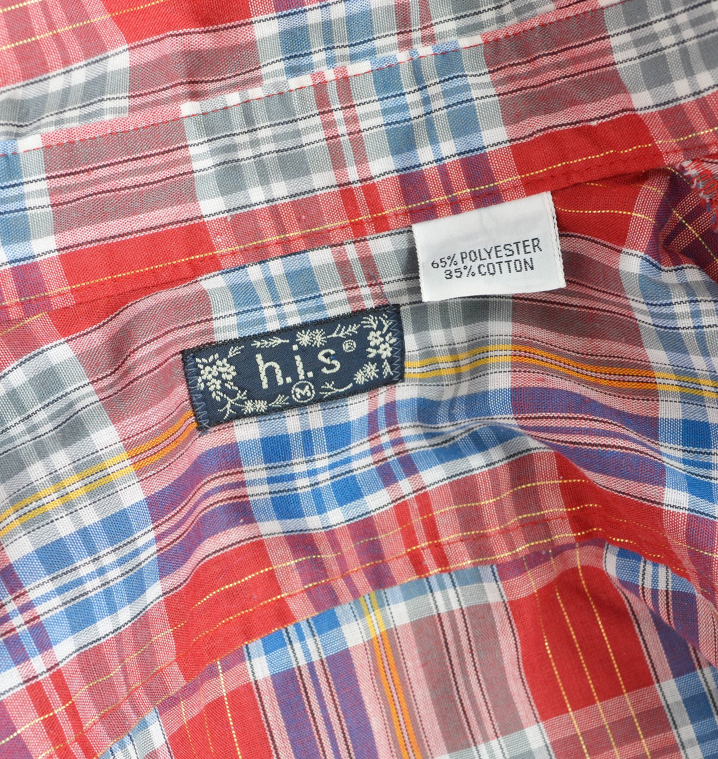 Close up view of h.i.s. vintage label inside of shirt collar.