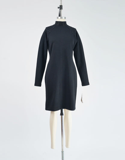 Full front view of black sweater dress with beading along the shoulders.