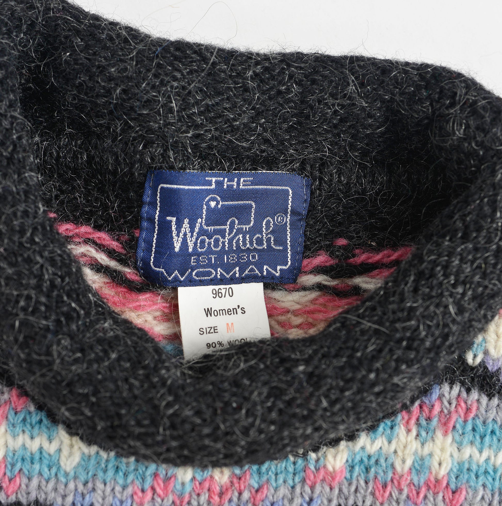 Woolrich label inside sweater neckline.