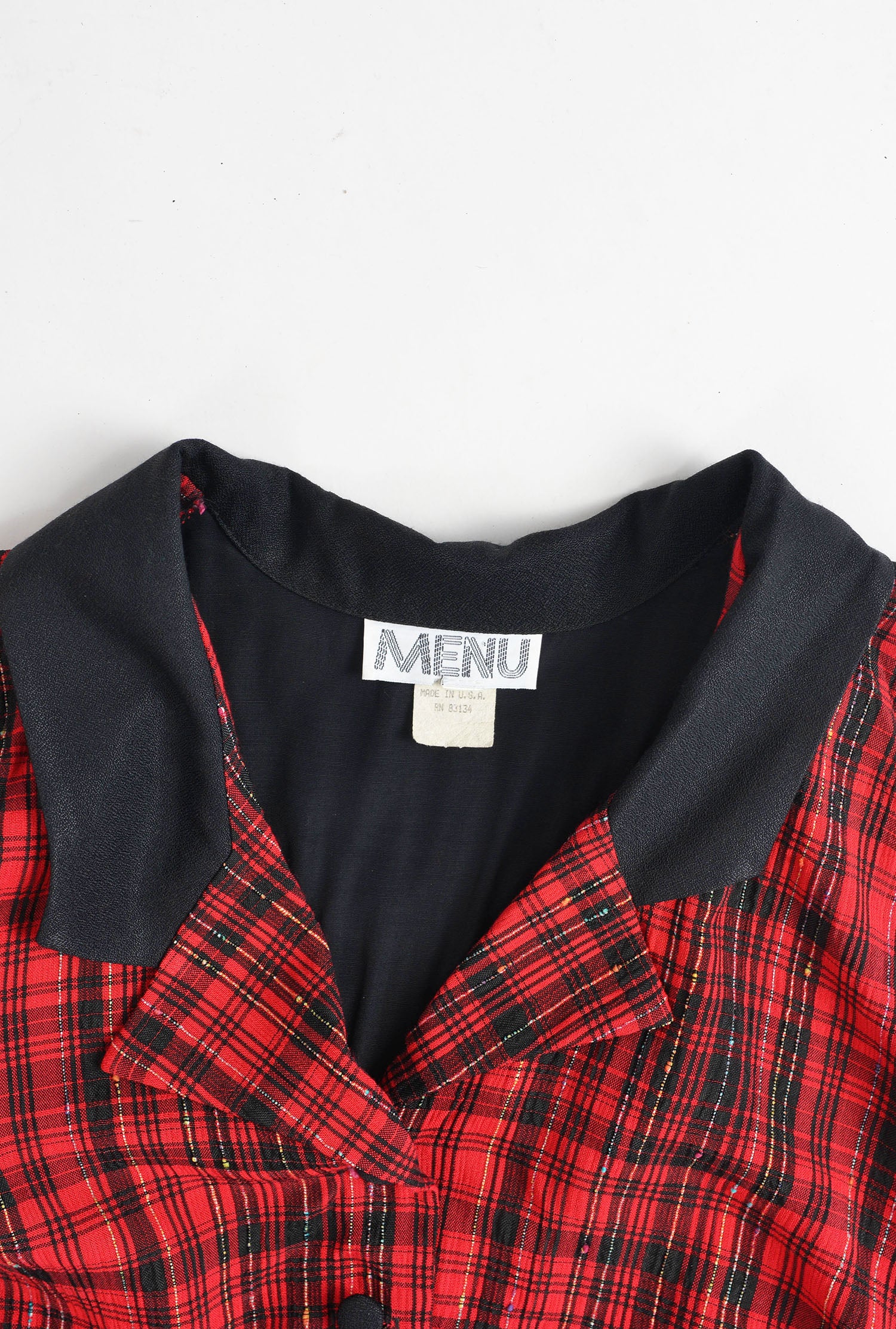 Close up view of designer label inside the neckline. 