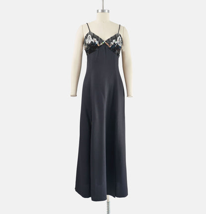 Fill view of Vintage black formal maxi dress with spaghetti straps. Metallic silver sequin and beaded bodice.