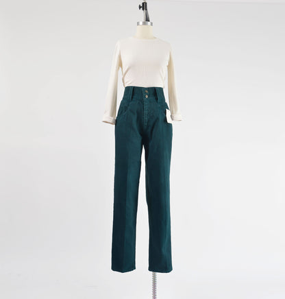 Vintage 90s dark green high waisted jeans with tapered legs.