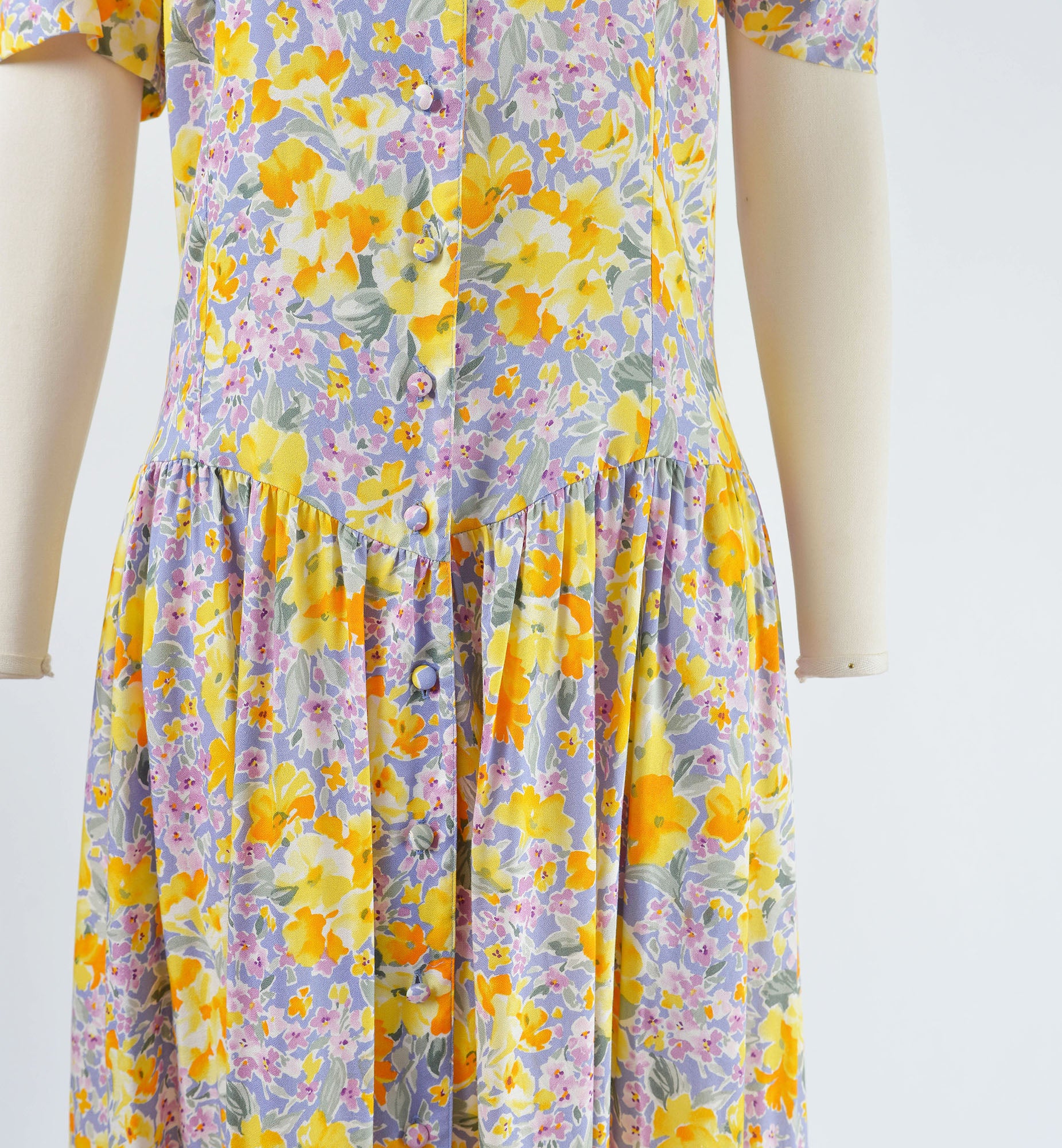 Close up of dropped waistline on 90s floral maxi dress.