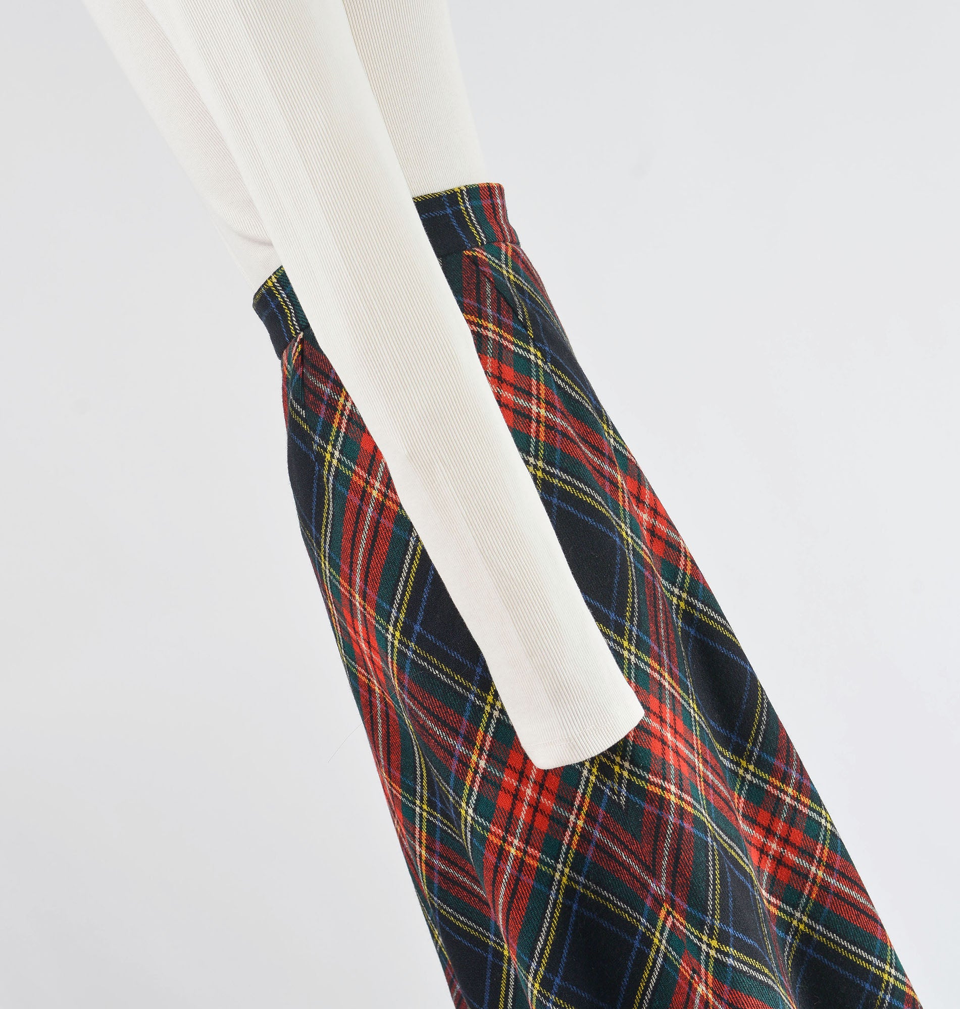 Side view of 1970s tartan plaid wool skirt.