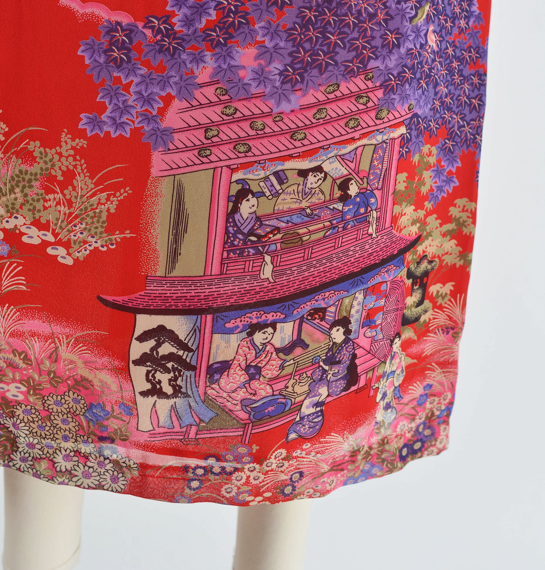 Close up view of vintage Geisha novelty print fabric. 