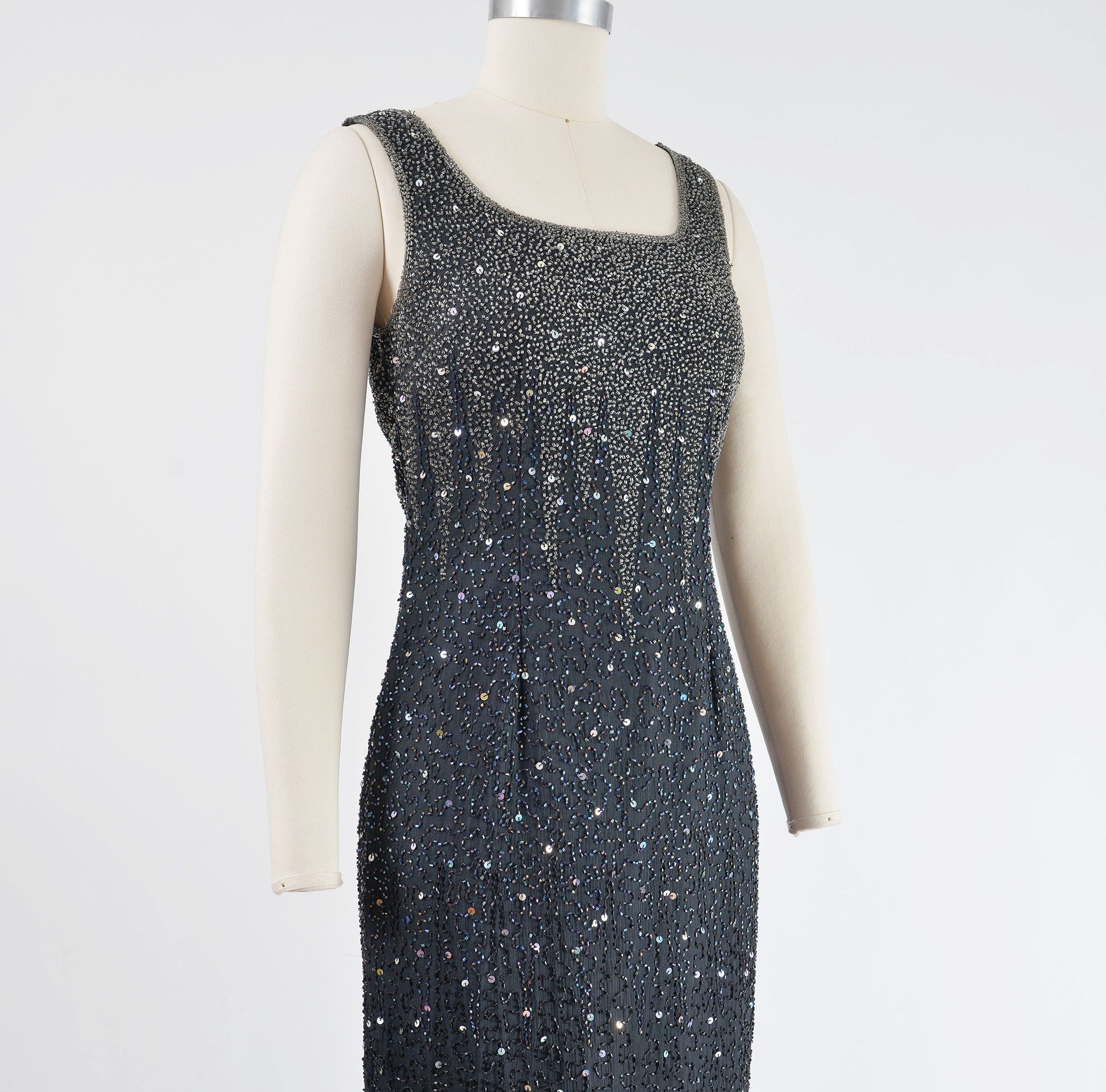 Side view of black dress with beading.