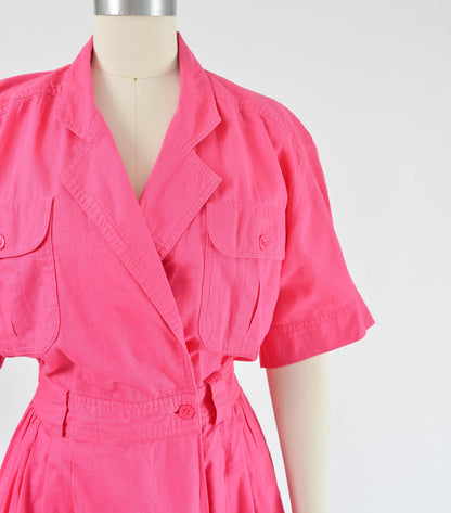 Close view of 1980s pink cotton shirt dress.