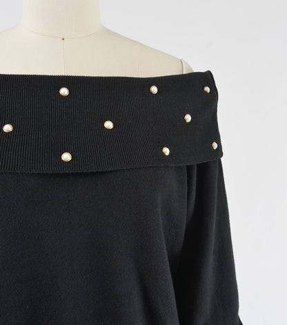 Close up view of 90s black cotton knit off shoulder sweater top.