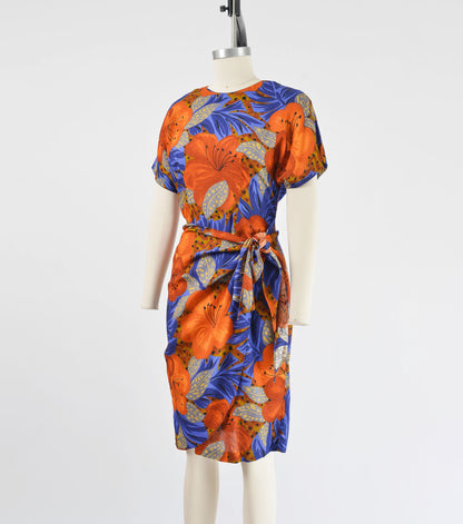 Side view of Vintage 90s floral print sarong style dress that ties at side waist.