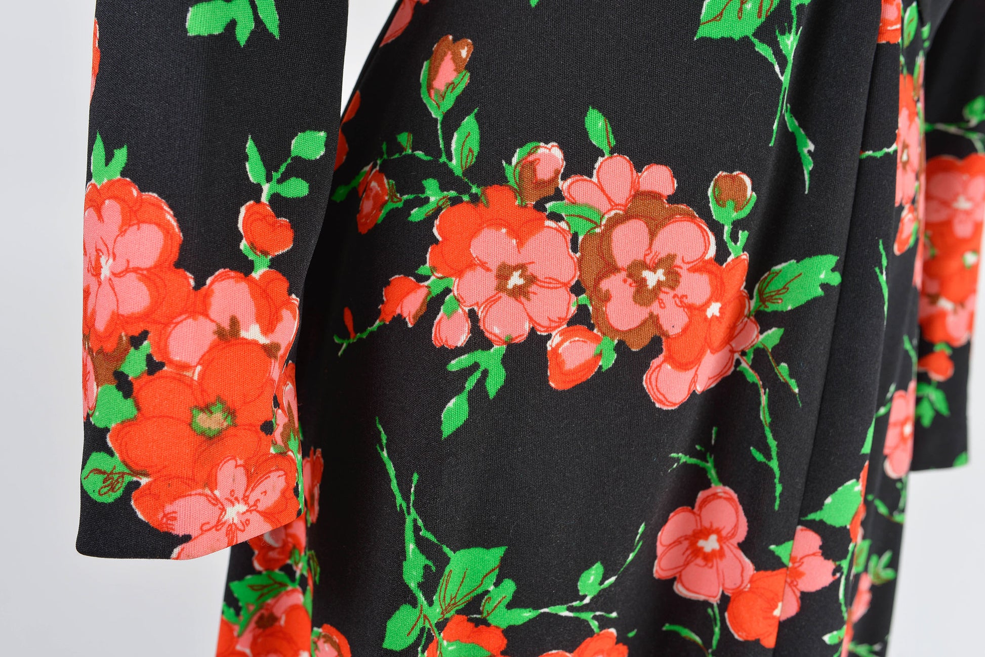 Close up view of the fabric on 70s floral maxi dress.