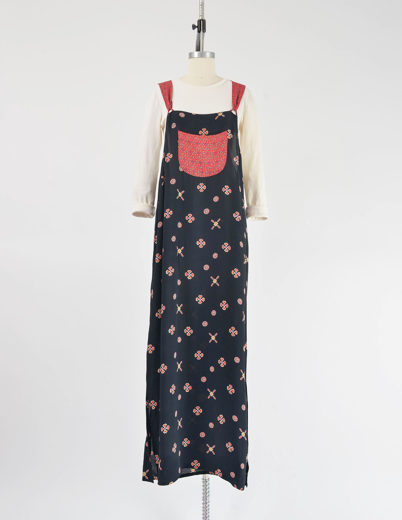 Full view of 1990s black and red overalls maxi dress.