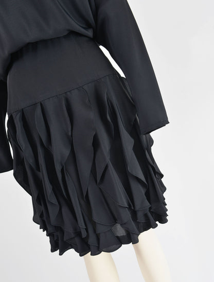 Close up of floucne ruffle skirt on 80s black dress.