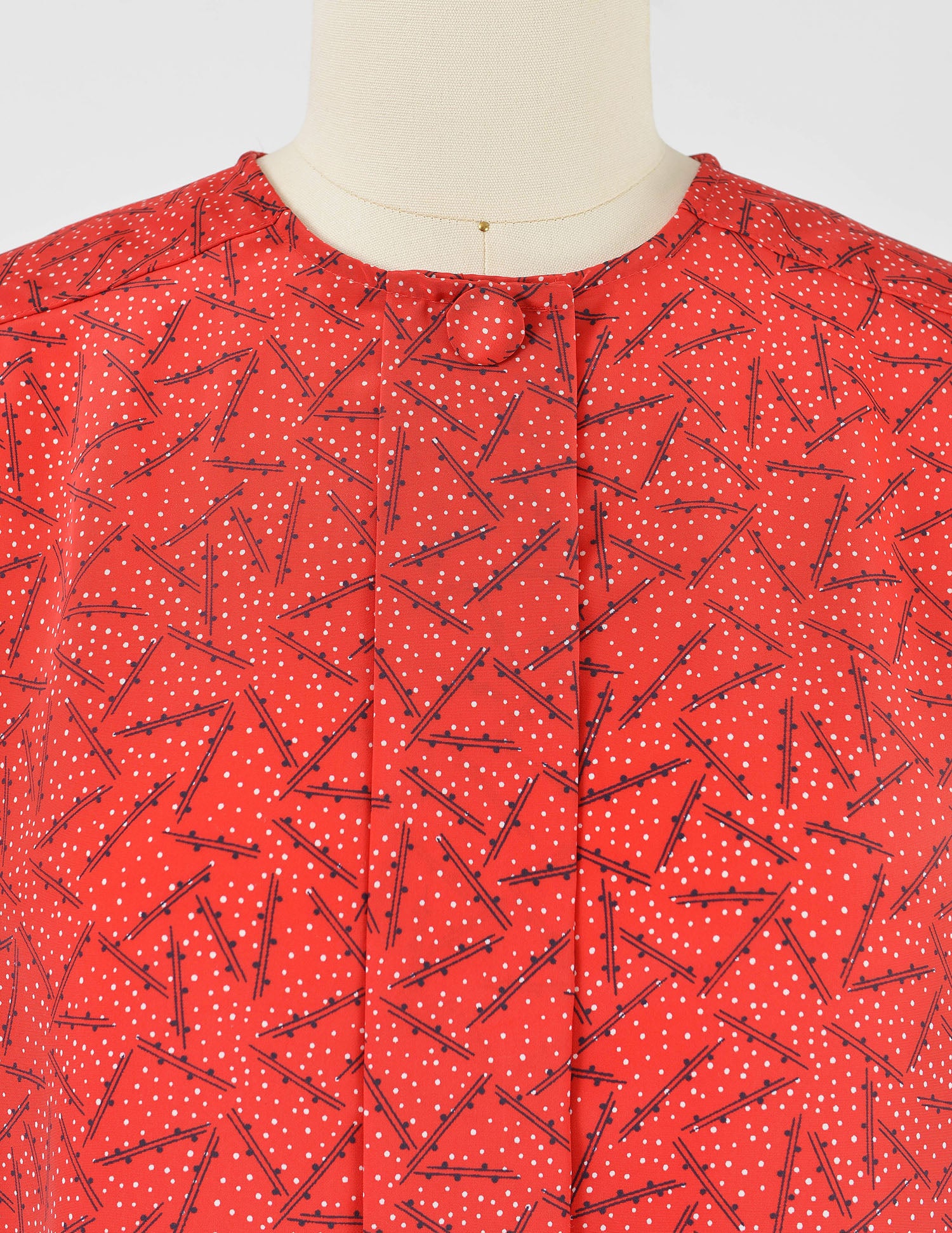 Neckline view of vintage 80s red polka dot blouse by Oscar de la Renta. 