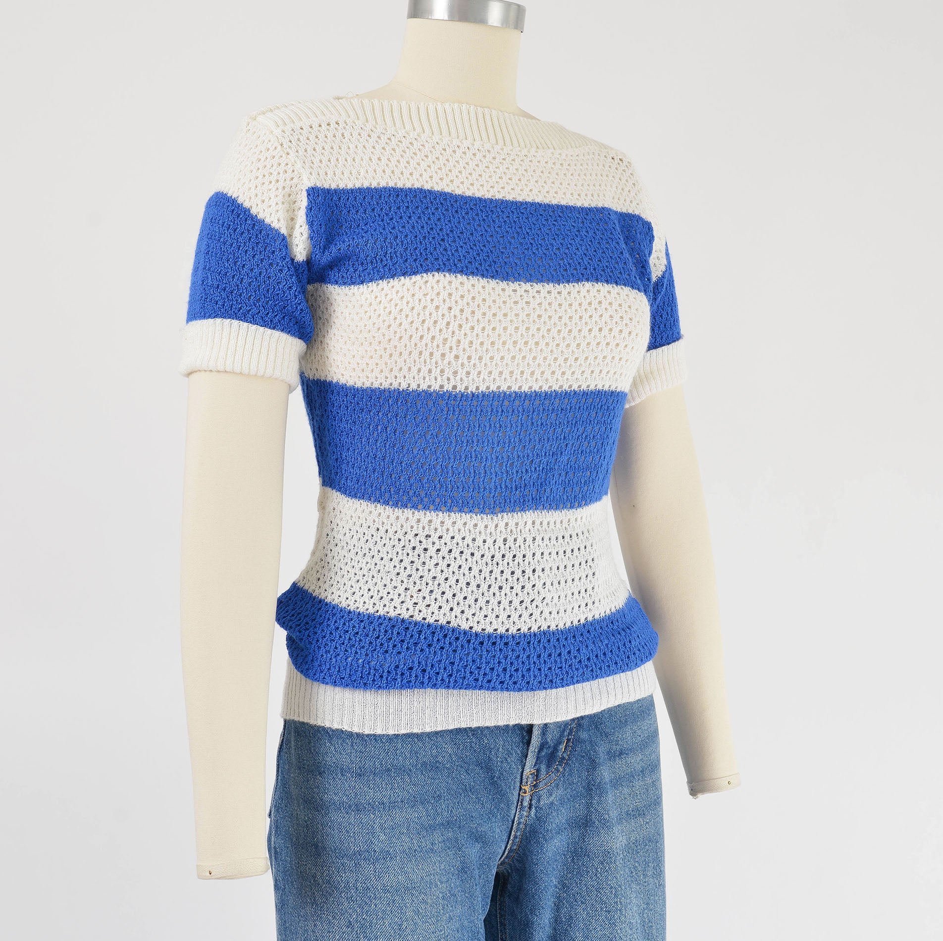 Side view of 1980s blue and white striped sweater.