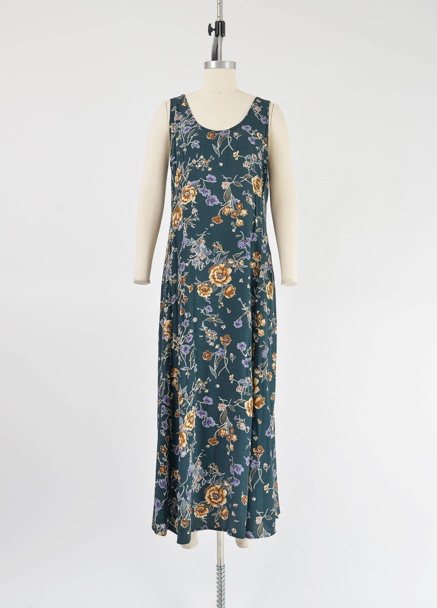 Full front view of vintage 1990s dark green floral print sleeveless maxi dress.