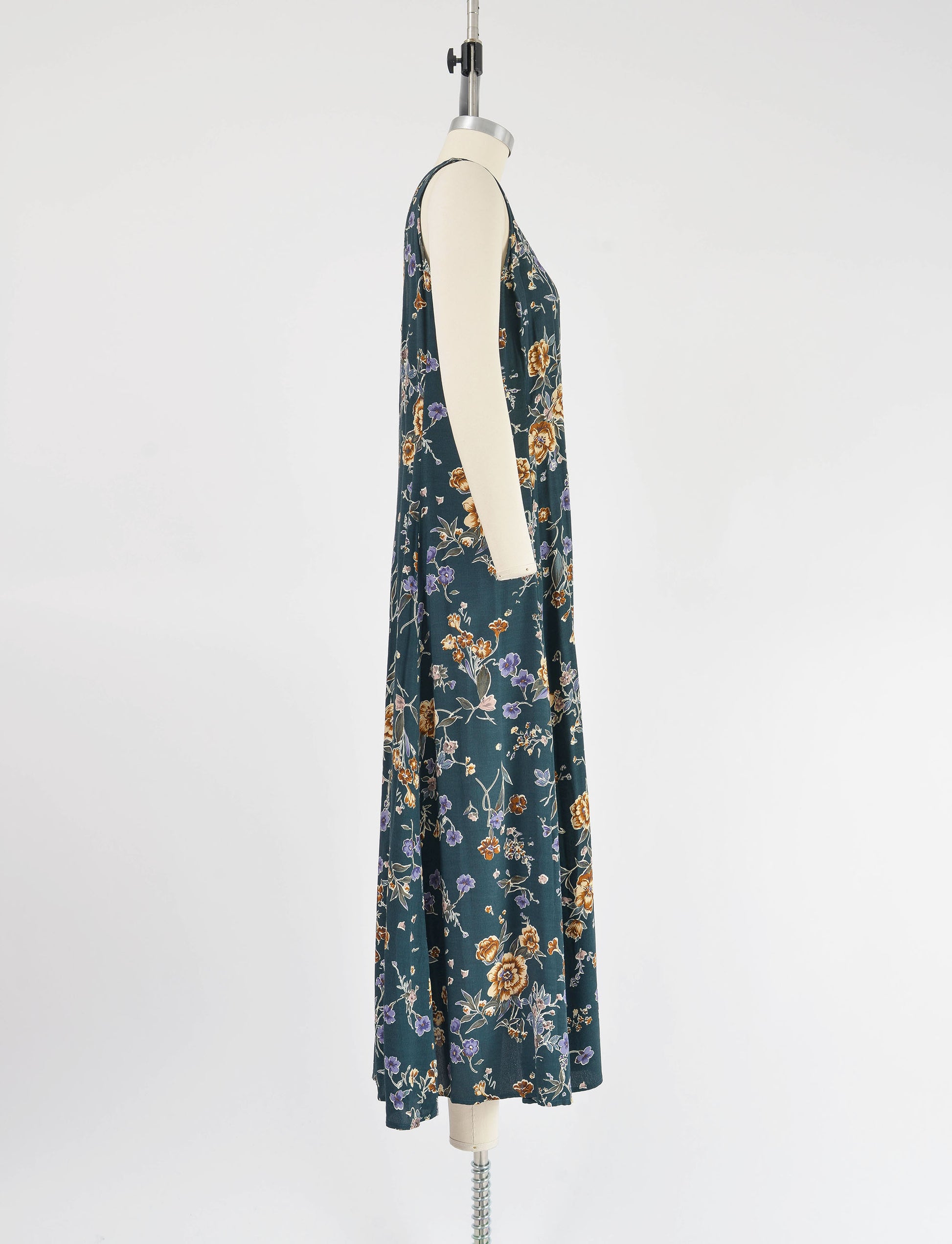 Side view of 90s green floral maxi dress. 