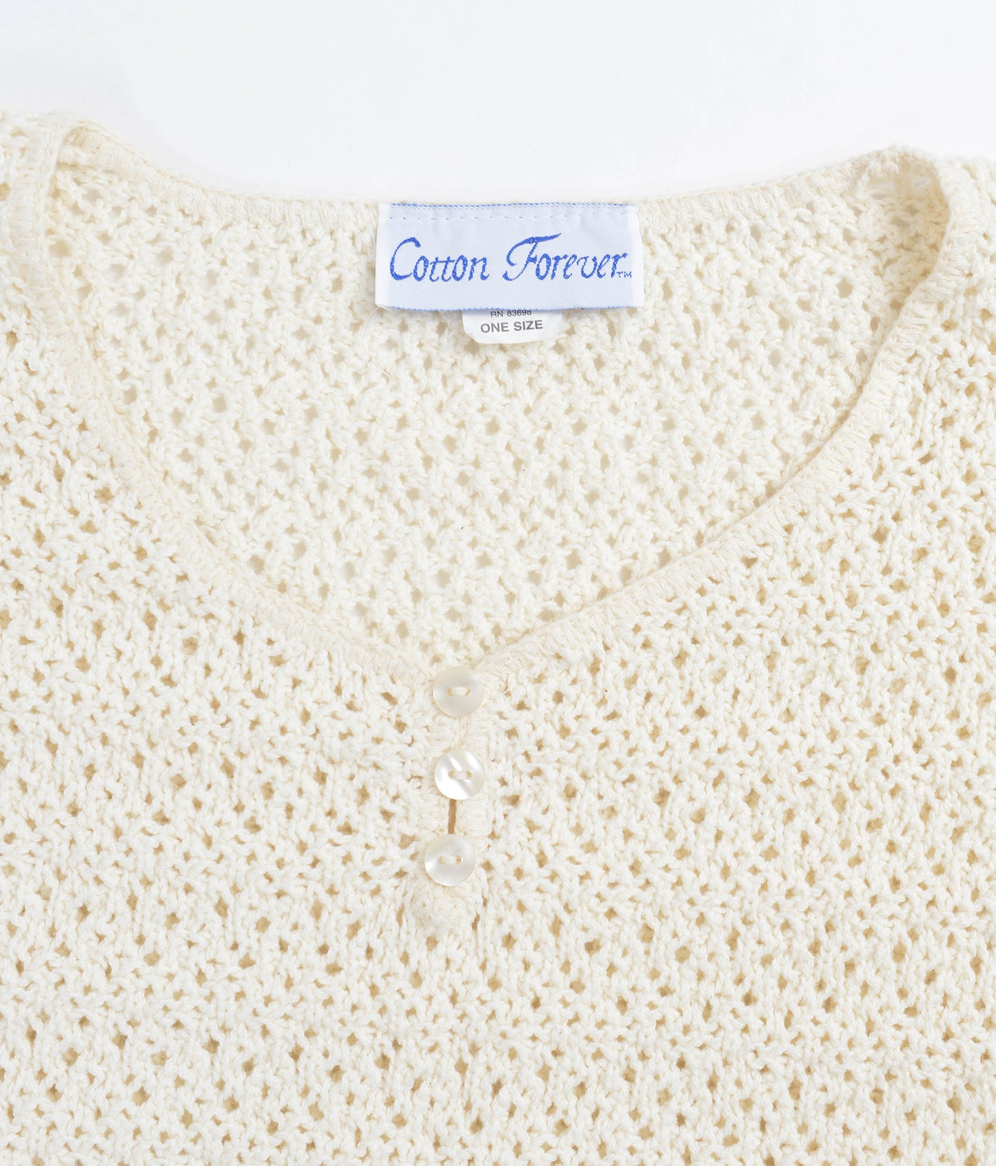 Cotton Forever label inside sweater neckline. 