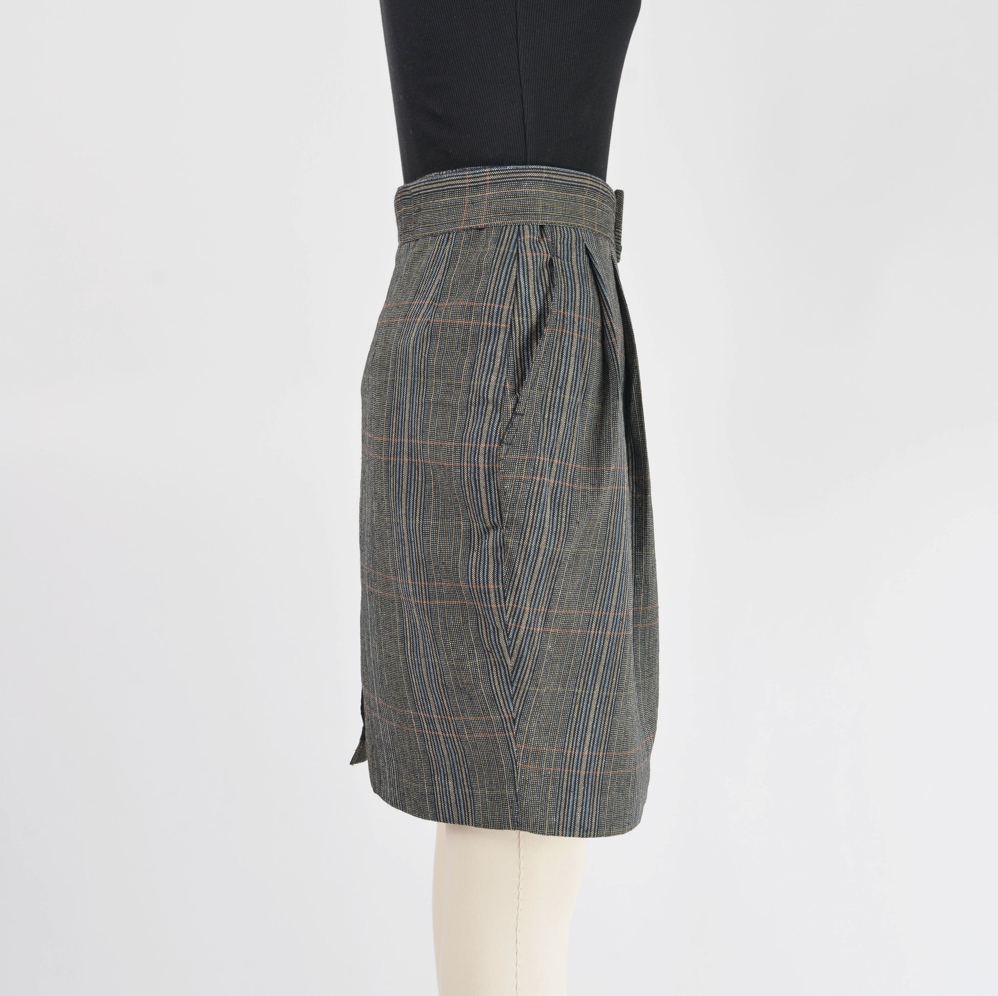 Side view of black plaid pencil skirt.