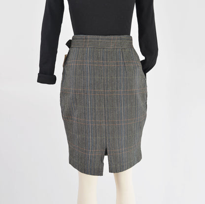 Rear view of black plaid pencil skirt.