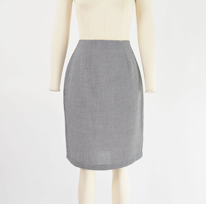 Full view of 80s black and white houndstooth pencil skirt.