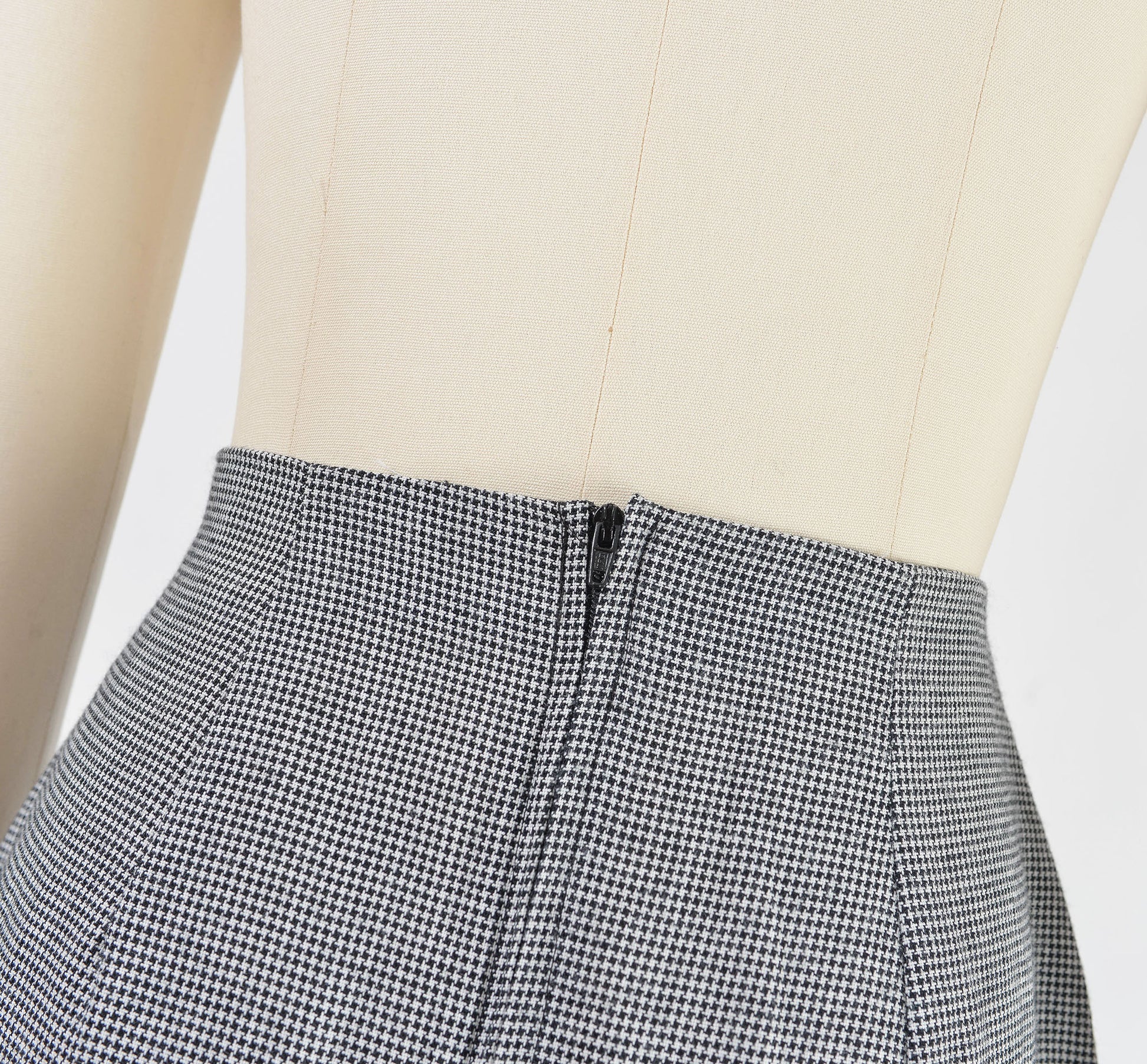 Close up view of zipper closure on the skirt.