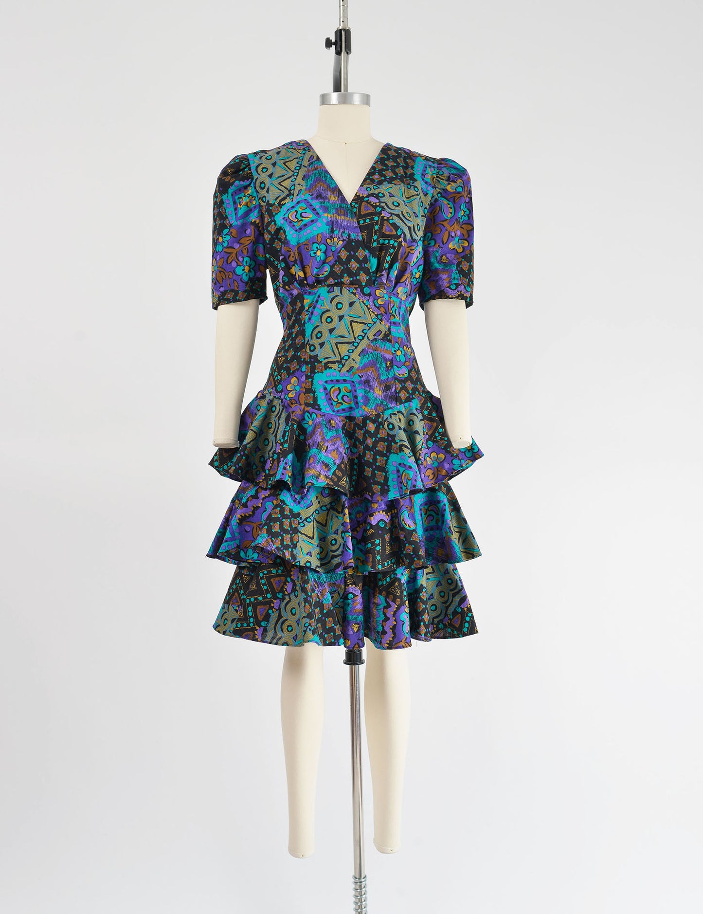 Full view of 80s abstract print cotton dress with tiered ruffle skirt.