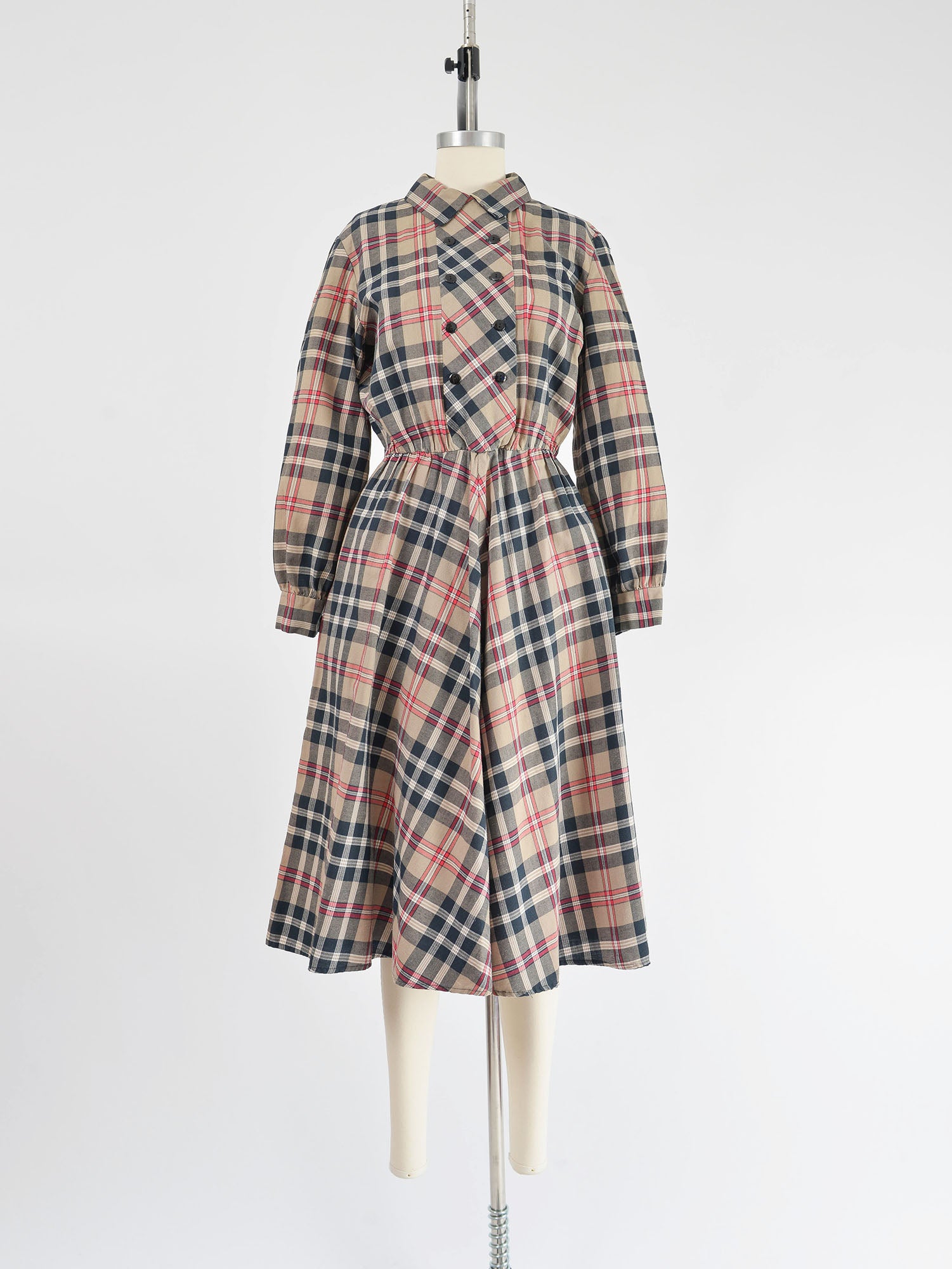 Vintage 1980s tan and black plaid cotton shirt dress. Collared neckline. Full skirt. Midi length.