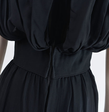 Back waistline of 60's black chiffon cocktail dress.