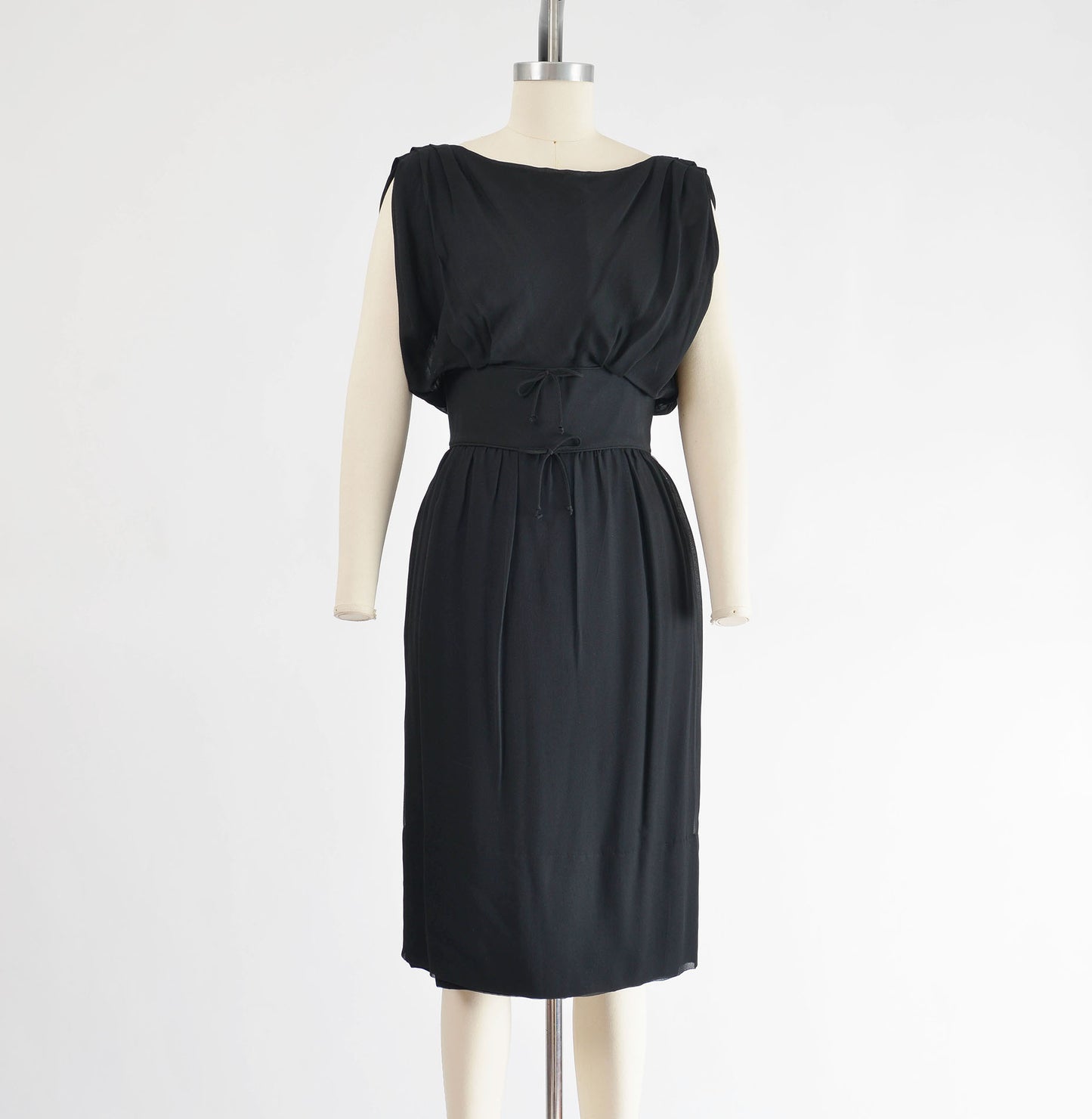 Front view of 1960's black chiffon cocktail dress. 