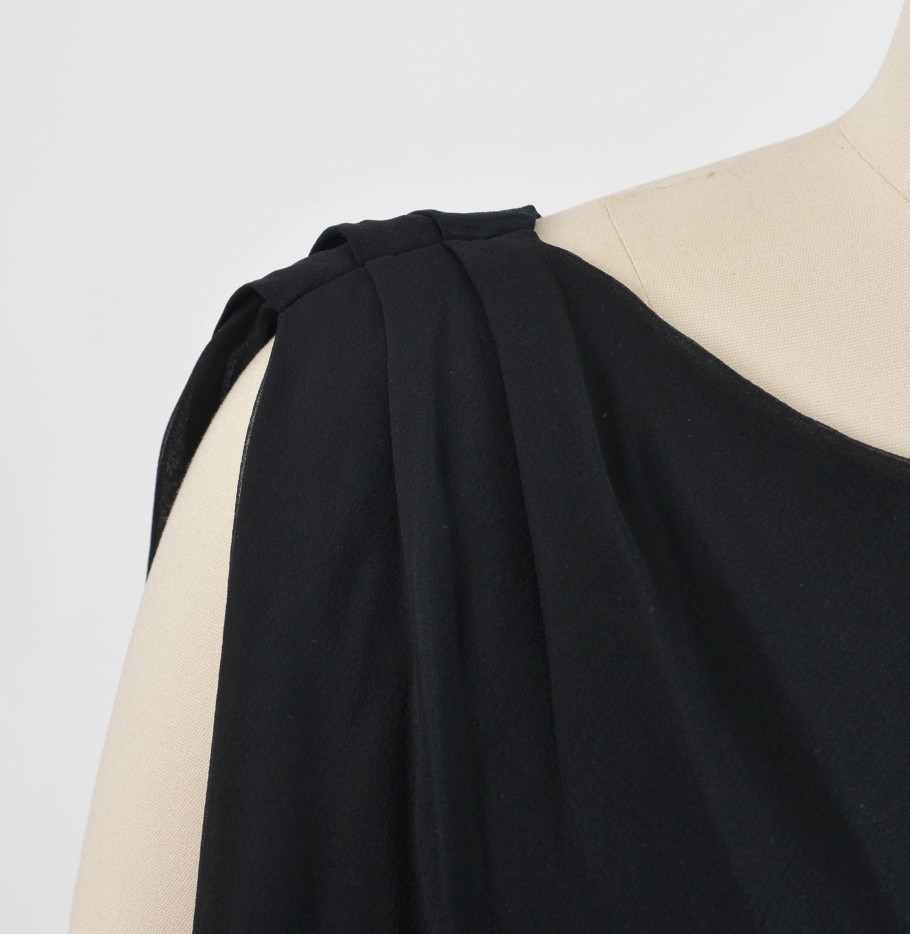 Shoulder pleating on 1960's black chiffon cocktail dress.