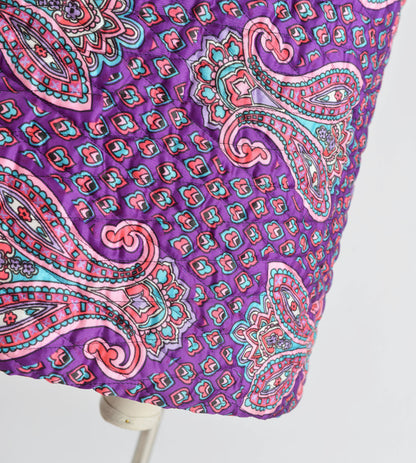 Close up view of paisley quilted fabric.