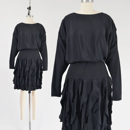 Vintage 80s black batwing sleeves dress with flounce ruffle skirt.